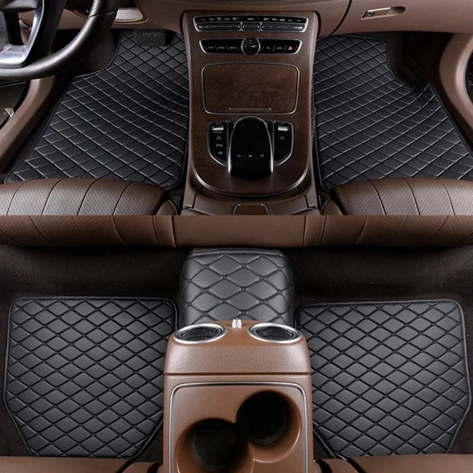 Interior view of a car with dark brown quilted floor mats and leather seating.