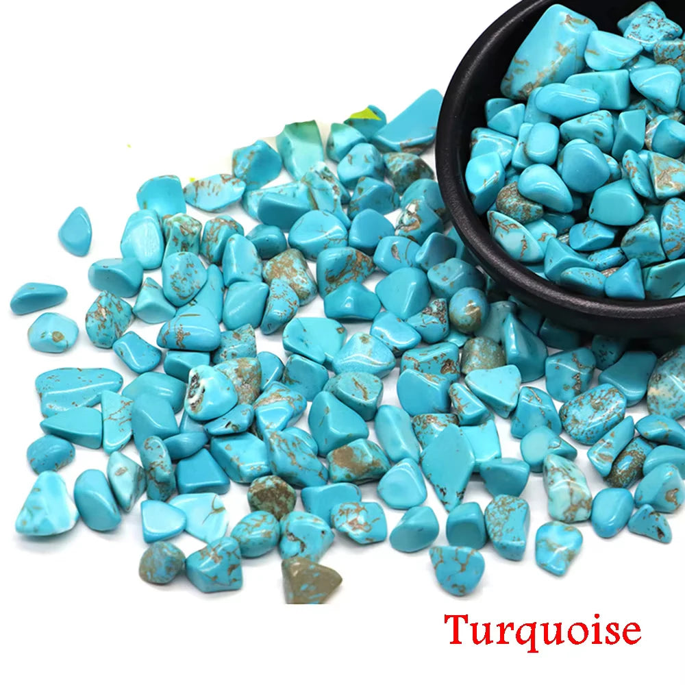 A pile of bright blue turquoise crystal stone chips in a black bowl.