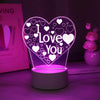 A glowing pink LED heart night light with a 'I Love You' design and surrounding small hearts.
