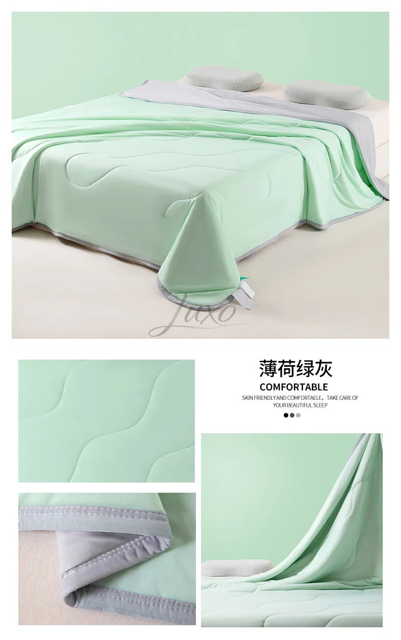 Light green ice silk cooling blanket draped over a bed, showing its quilted texture and soft fabric.