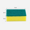 A rectangular scouring pad showing a green foam layer on top and a yellow foam layer underneath.