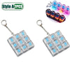 A set of clear silicone LED fidget keychains with a keyboard design and a colorful LED keychain.