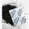 A pile of black food grade oxygen absorbers next to a white packet labeled DO NOT EAT and DEOXIDIZER.