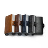 A set of four slim wallets in brown, gray, blue, and black leather with silver accents.