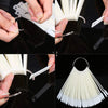 Hands demonstrate using a clear acrylic false nail tips kit for practice and display.