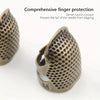 A close-up view of a vintage metal sewing thimble with a dense round concave finger protection ring.
