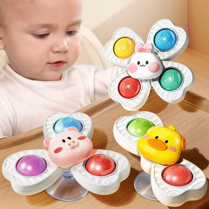 A set of colorful spinning bath toys for toddlers featuring various animal shapes like a pig and a duck.