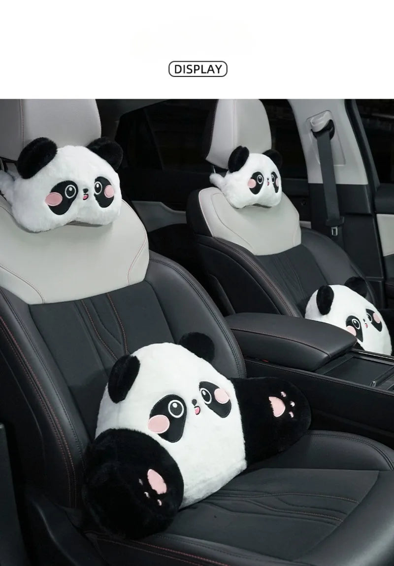 A white and black panda plush cushion is placed on a car seat headrest.