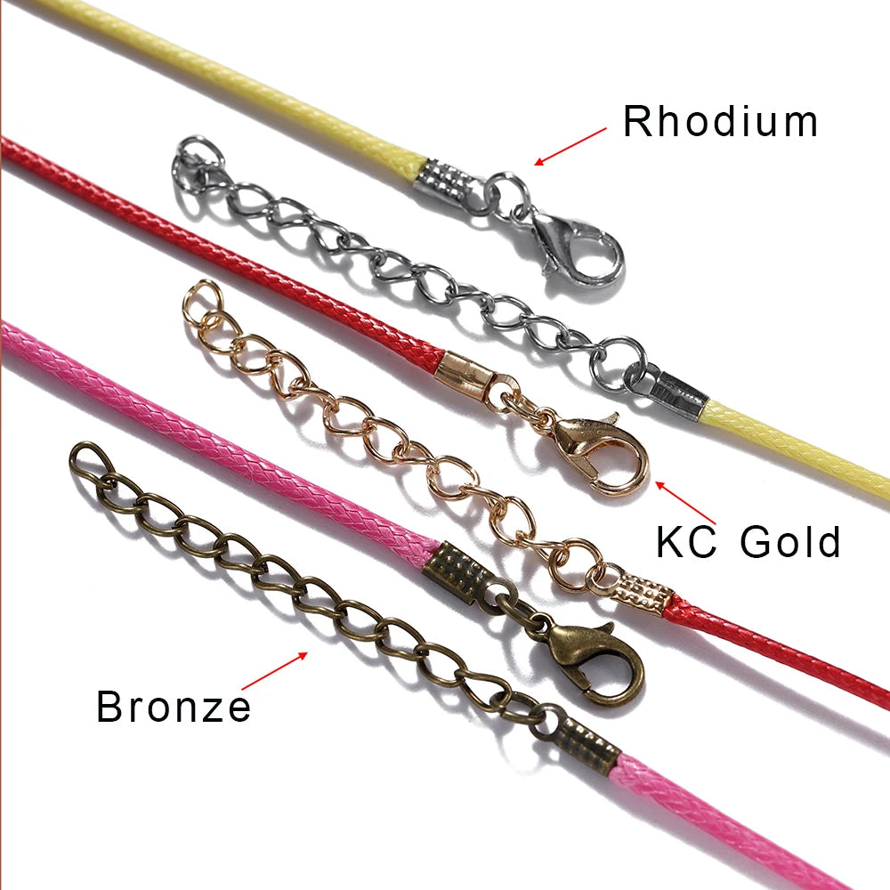 A collection of adjustable leather cord necklaces featuring rhodium, KC gold, and bronze metal chains.