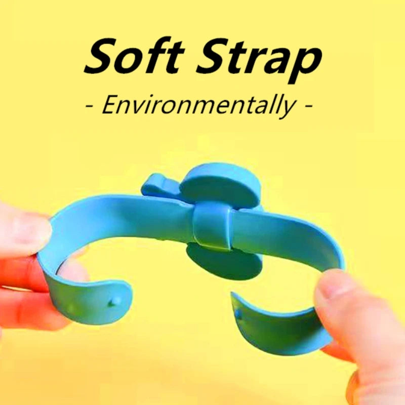 A hand is holding a soft strap silicone band for a kids' dinosaur digital watch.