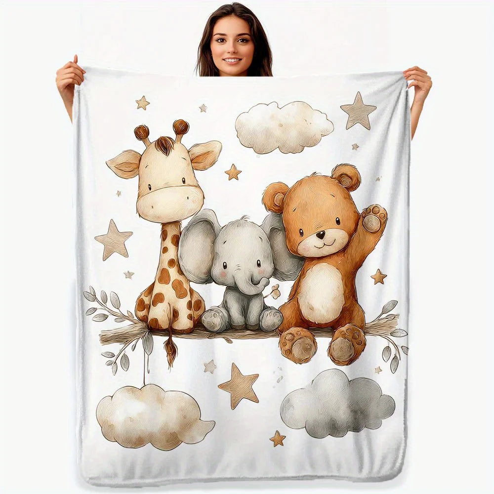 A white blanket featuring a watercolor print of a giraffe, an elephant, and a teddy bear.