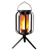 A black solar flickering flame lantern hanging from a metal frame.