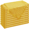 A stack of six golden yellow raw-edge polyester cloth napkins.