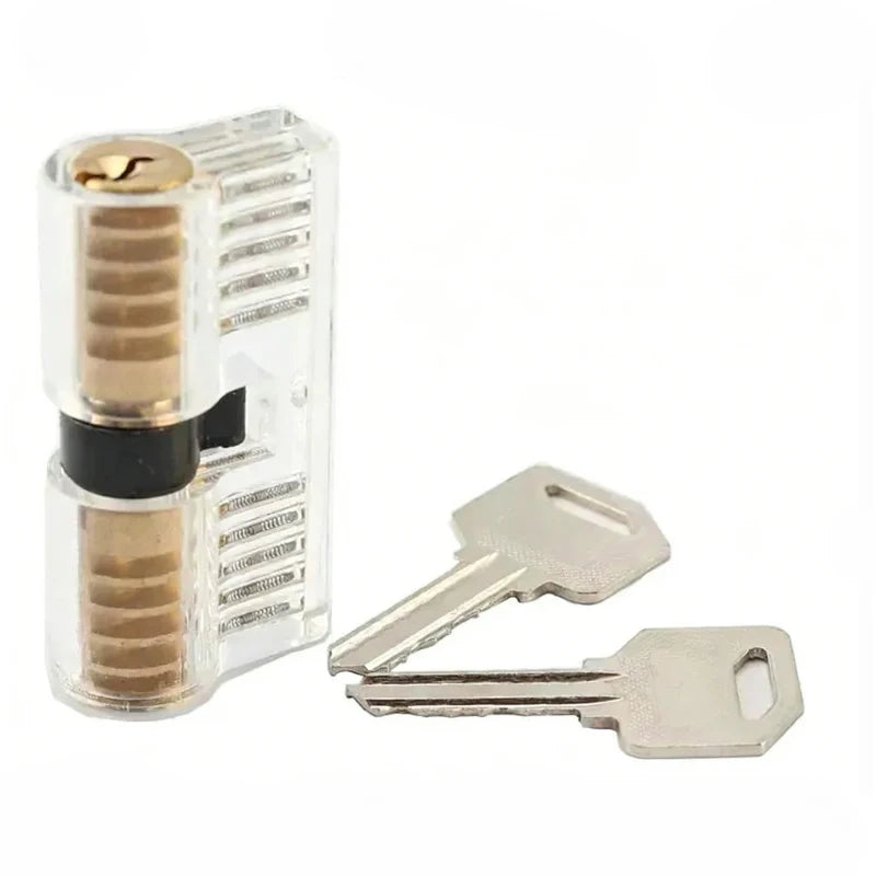 A transparent practice padlock with a key is shown next to a metal key for locksmith training.