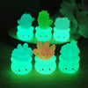 A set of glowing green succulent cactus miniatures in small pots used for home decor.