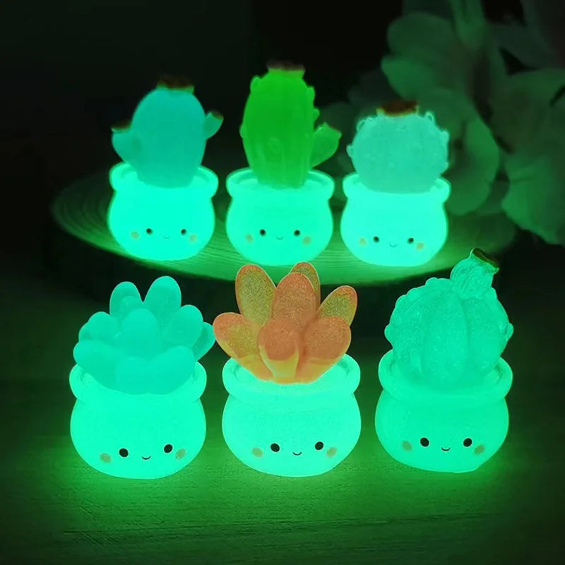 A set of glowing green succulent cactus miniatures in small pots used for home decor.