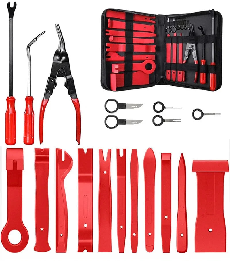 A collection of red car trim removal tools and accessories stored in a black pouch.