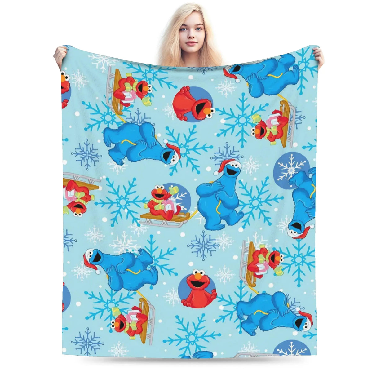 A blue and white flannel throw blanket featuring Sesame Street Friends characters and snowflakes.
