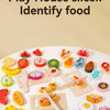 A wooden pretend play set featuring various fruit and vegetable slices for kids to identify food.