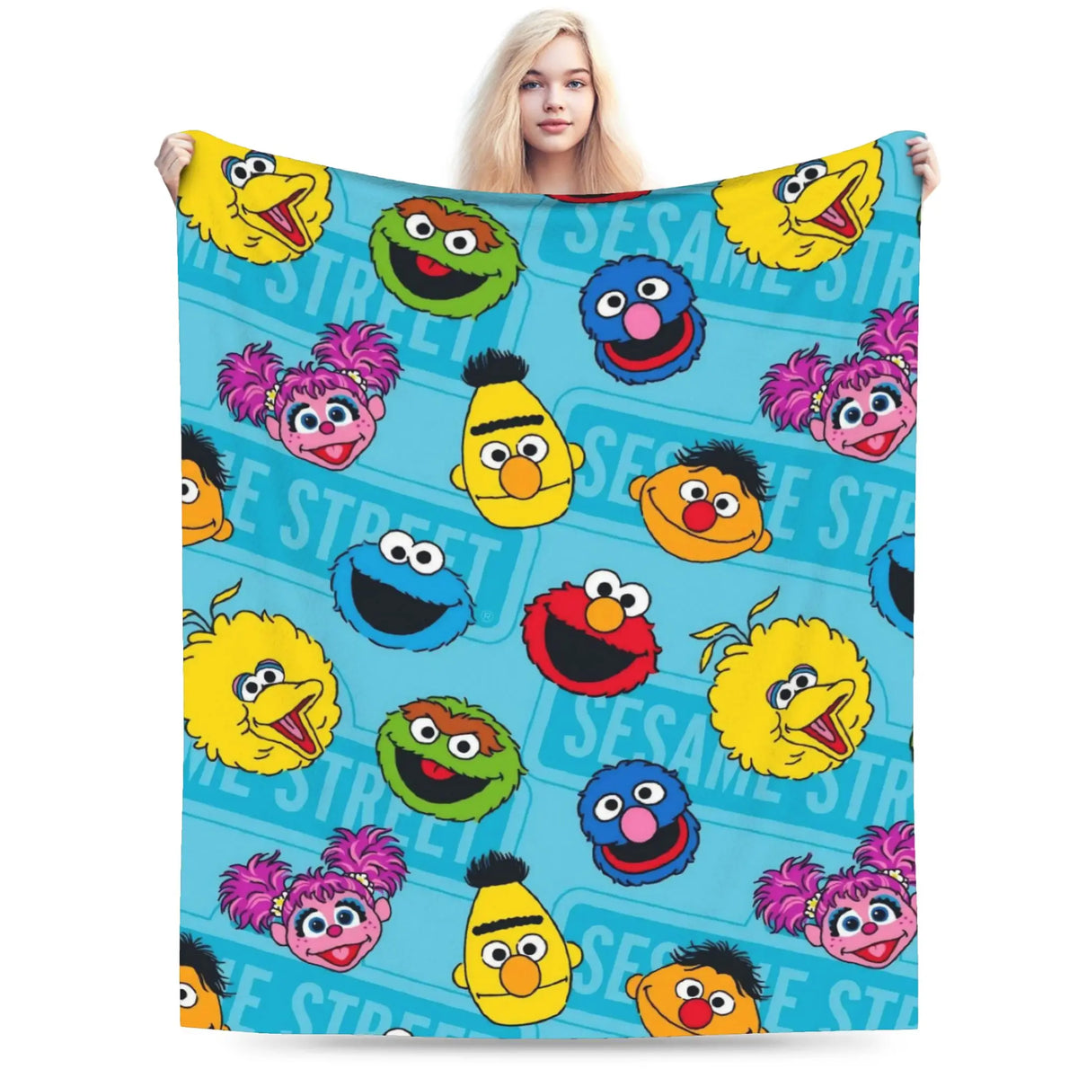 A colorful flannel throw blanket featuring multiple smiling yellow and blue Sesame Street characters.