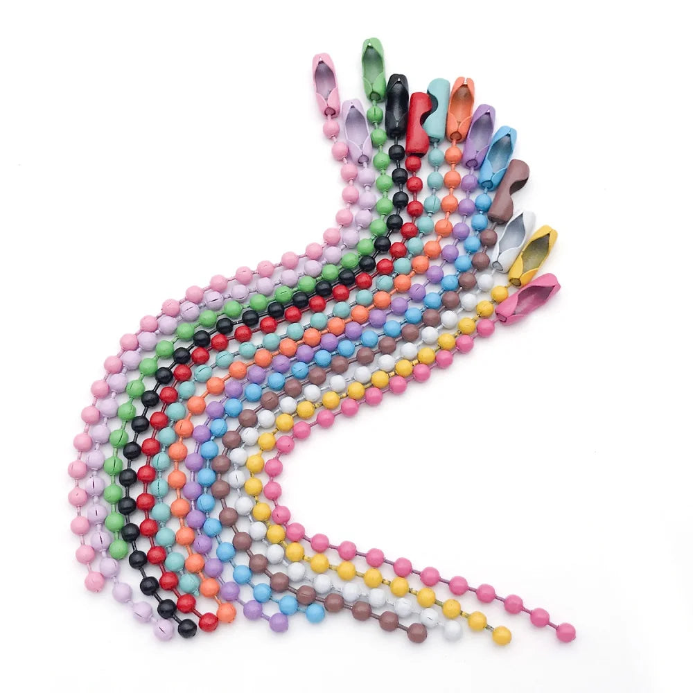 A long, curved strand of colorful ball beads in various shades of pink, blue, green, and yellow.
