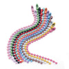 A long, curved strand of colorful ball beads in various shades of pink, blue, green, and yellow.