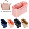 Various felt purse organizer inserts and a pink tote bag for storage