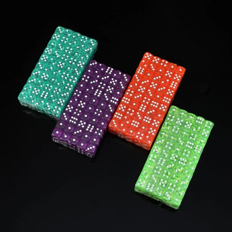 A set of three rectangular acrylic D6 dice in green, purple, and red are displayed on a black surface.