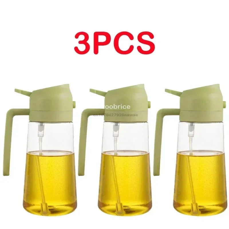 Three glass oil spray bottles with green caps and yellow oil inside