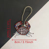 Handcrafted rhinestone bag charms featuring a sequin octopus and turtle pendant keychains
