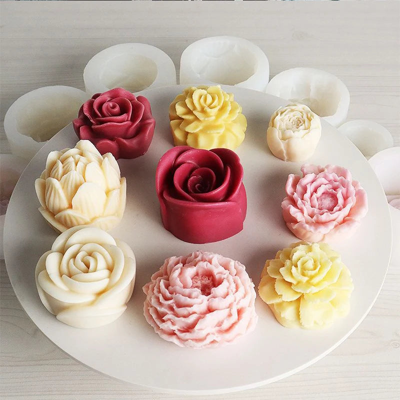 A collection of pink, yellow, and white 3D rose peony silicone molds for crafts.