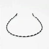 Schwarzes Metal-Elastband mit gewundener Form für lockiges Haar