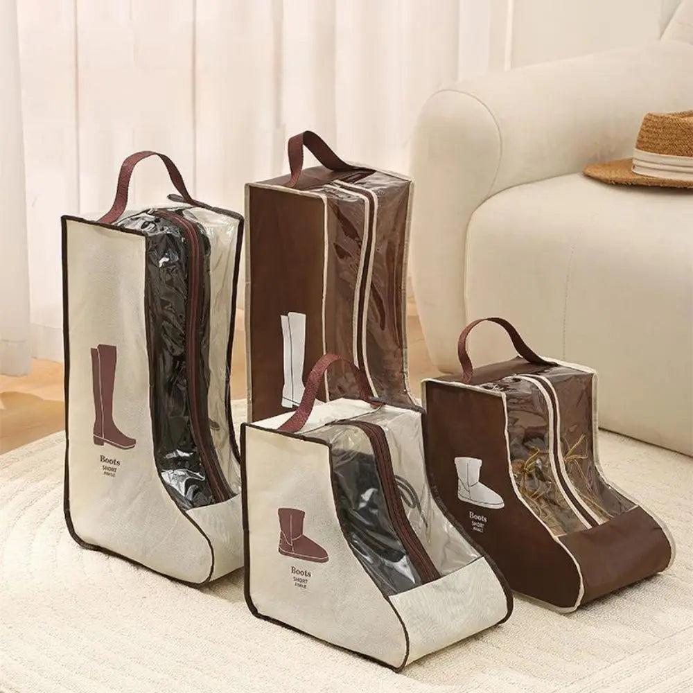 Brown and gray storage bags for tall boots with handles, displayed on a light rug next to a sofa.