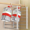 A silver multi-layer hanger displaying two clear glass bottles with red and white bands.