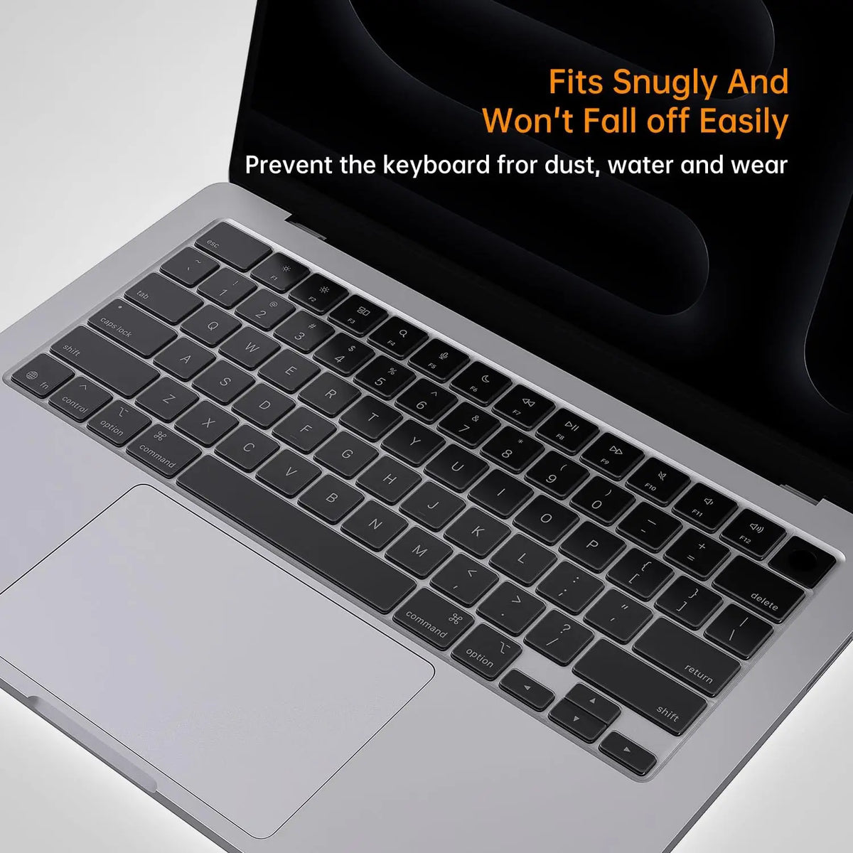 A silicone keyboard cover is shown fitting snugly onto a silver MacBook Pro or Air keyboard.