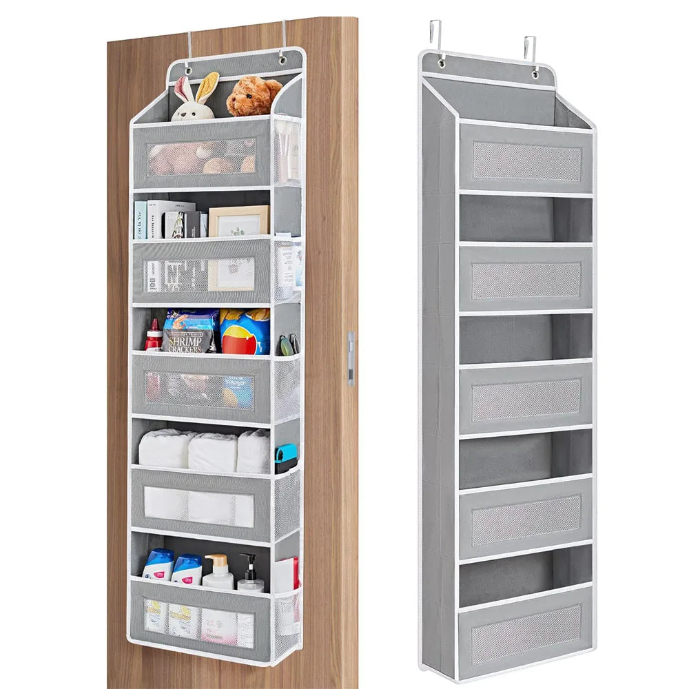 A tall, gray over-the-door hanging organizer with five mesh pockets mounted on a wooden door.
