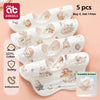A stack of five white soft cotton muslin bandana bibs for babies with floral and animal prints.