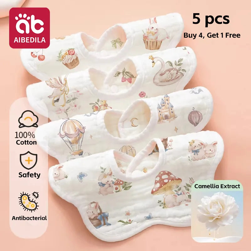 A stack of five white soft cotton muslin bandana bibs for babies with floral and animal prints.