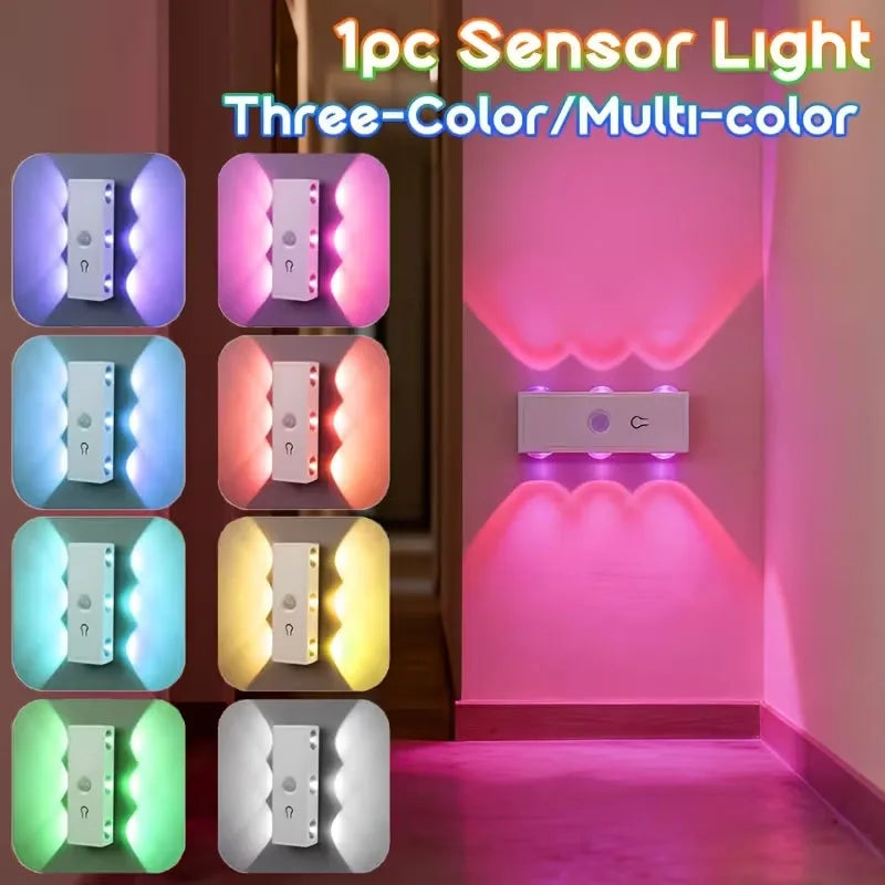 A set of five three-color sensor lights illuminating a pink wall and floor.