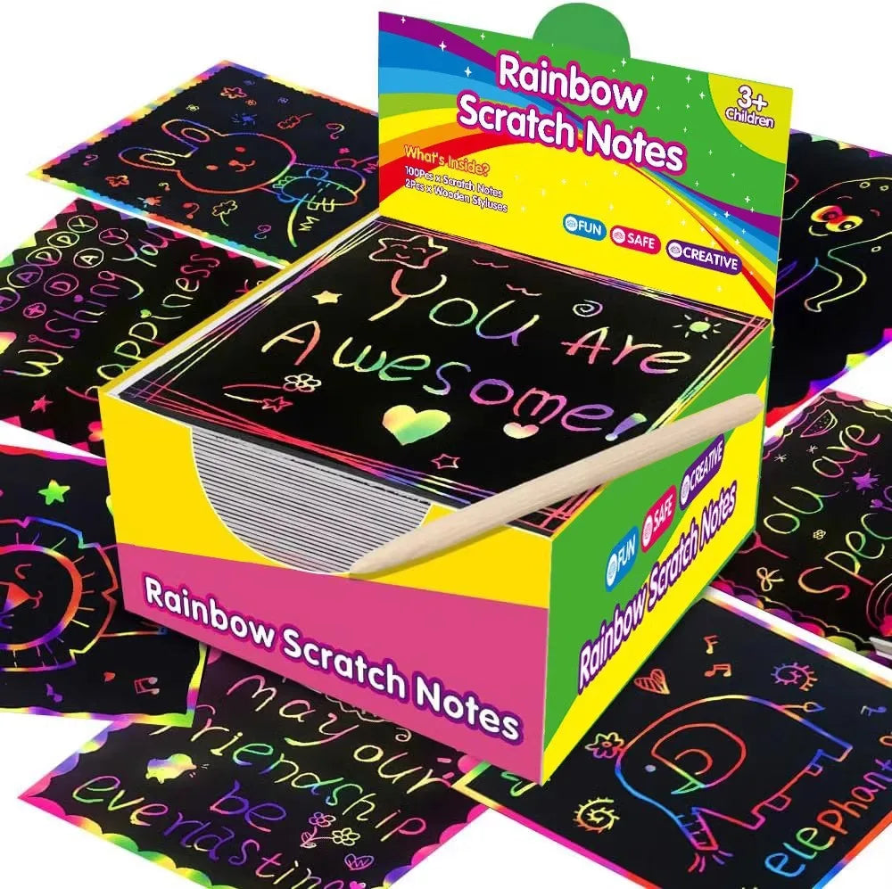 A box of Rainbow Scratch Notes featuring colorful paper and a wooden stylus for art