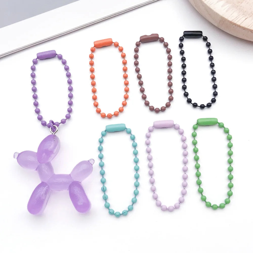 A collection of colorful ball bead chains in various colors and styles for keychains and jewelry making