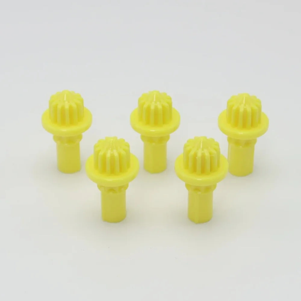 A set of five yellow replacement drivers for a Takara Tomy battling top, shown against a white background.