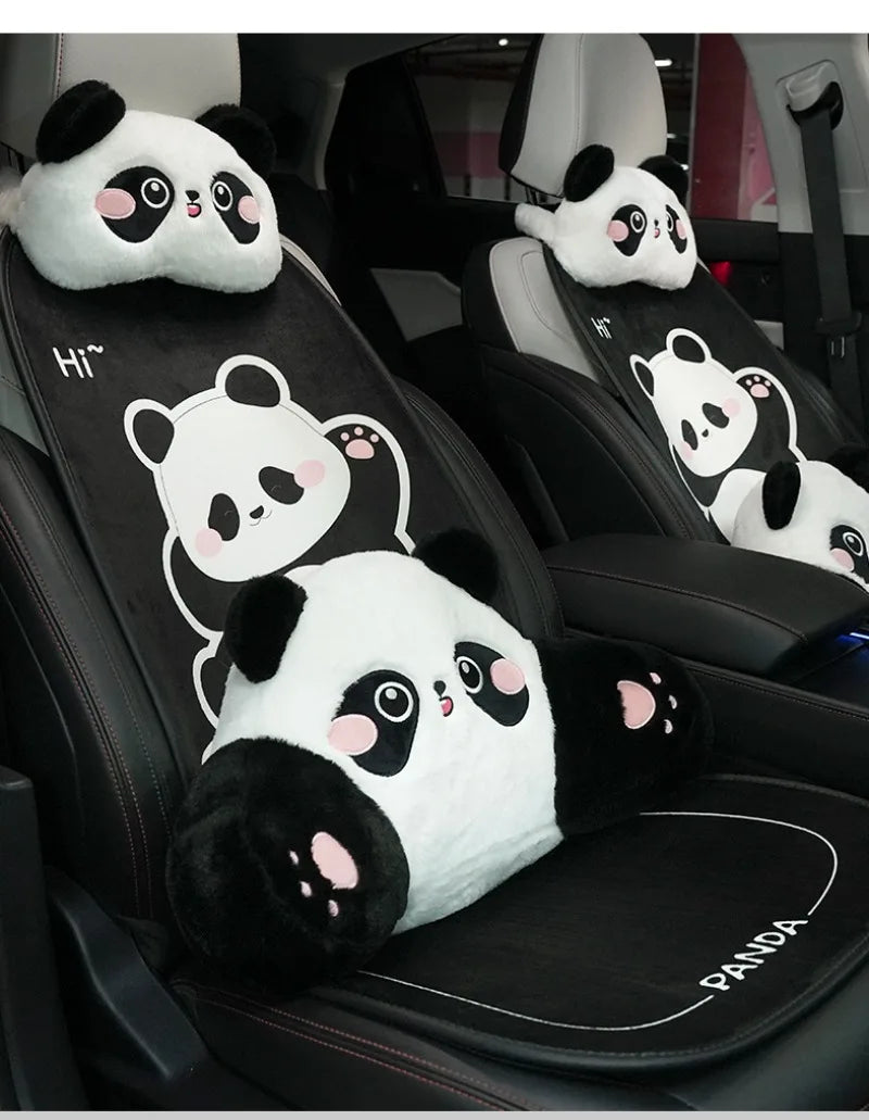 A row of panda plush car headrests and lumbar support cushions in black and white on a car seat.