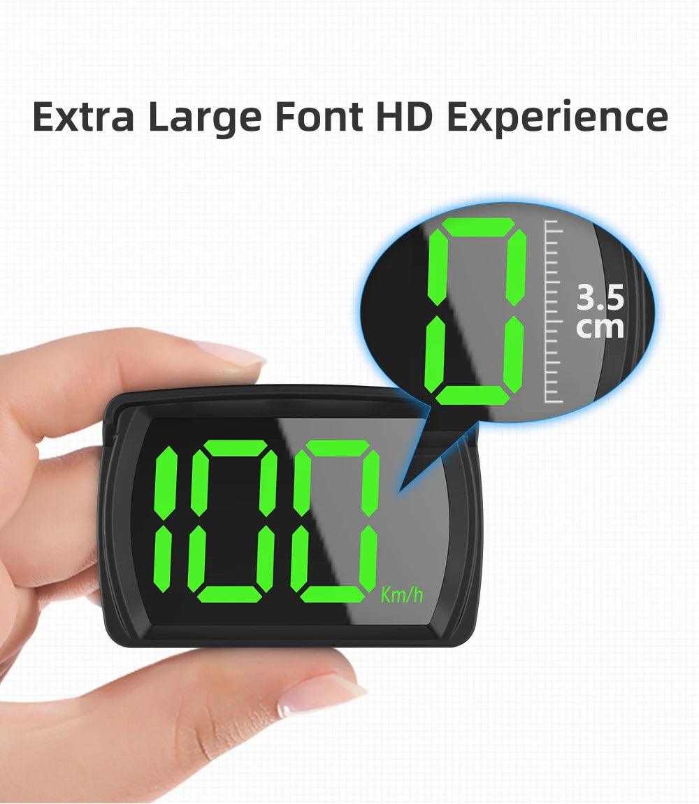 A hand holds a black speedometer device displaying 100 Km/h on a green LED screen.