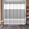 A shower curtain featuring a striped pattern of light gray and white horizontal bands.