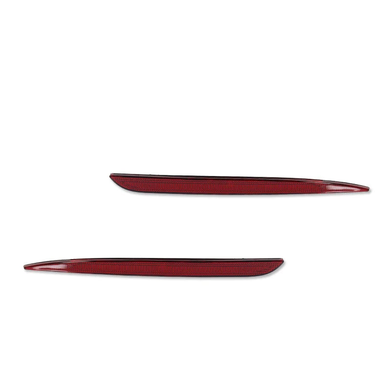 A pair of red rear bumper reflector light covers for a Chrysler 300 vehicle.