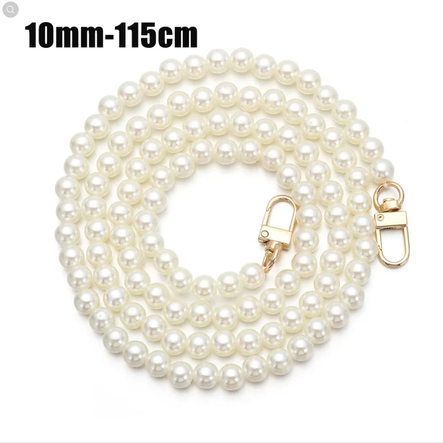 A strand of small, round white pearls measuring 10mm to 115cm, featuring a gold-toned clasp.