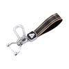 A black and gold durable TPU car key case cover with a silver clasp.