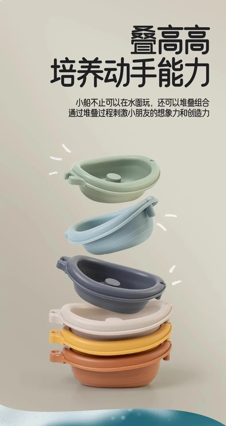 A stack of various colored silicone sensory bath toys for toddlers, including cups and bowls.