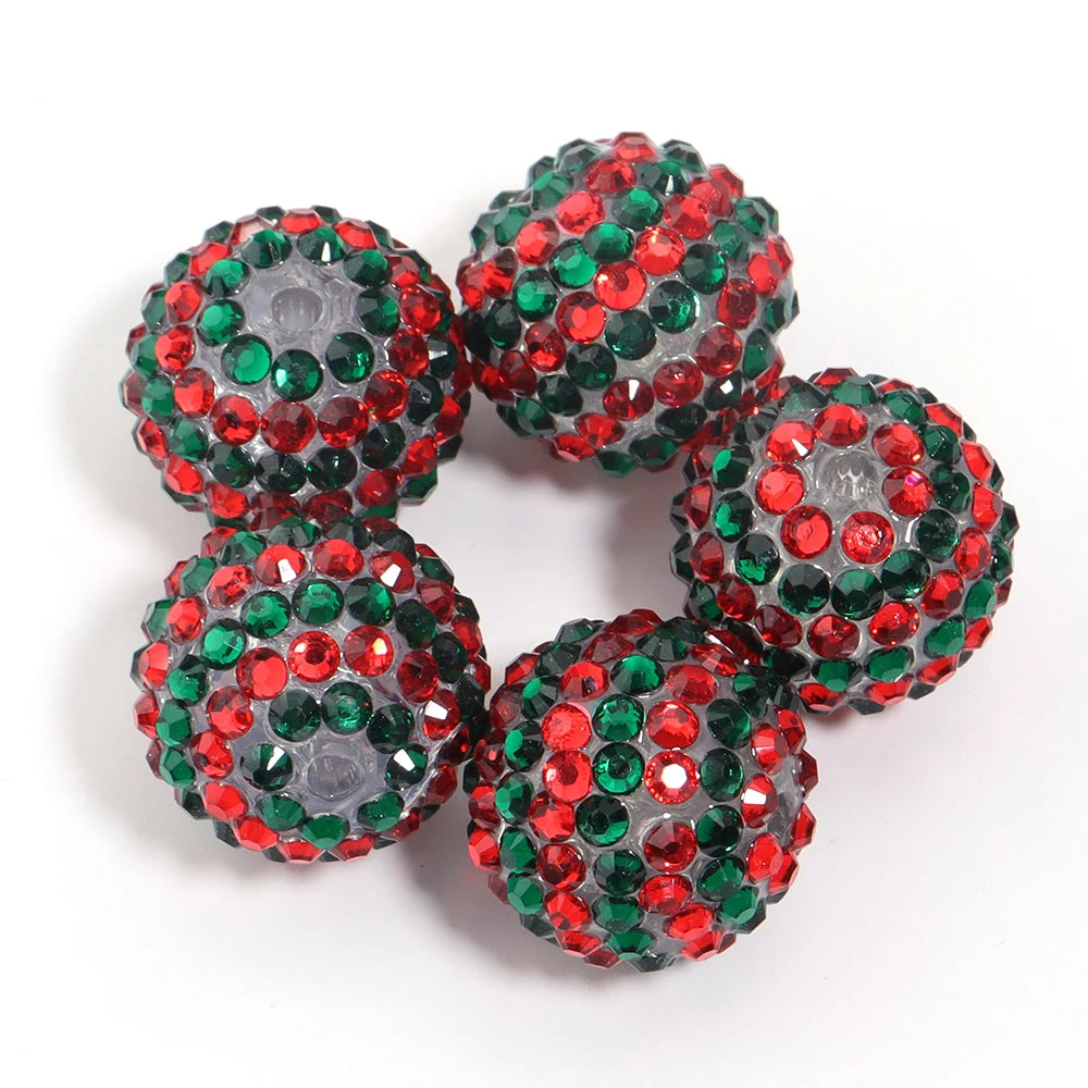 A set of five resin rhinestone beads with a two-tone red and green striped design.